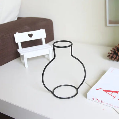 Nordic Style Iron Flower VaseInfuse your space with Nordic charm using our Nordic Style Iron Flower Vase, a stylish and versatile accent for your home.🏡 Nordic Design: Simple yet elegant iron cModernModernNordic Style Iron Flower Vase